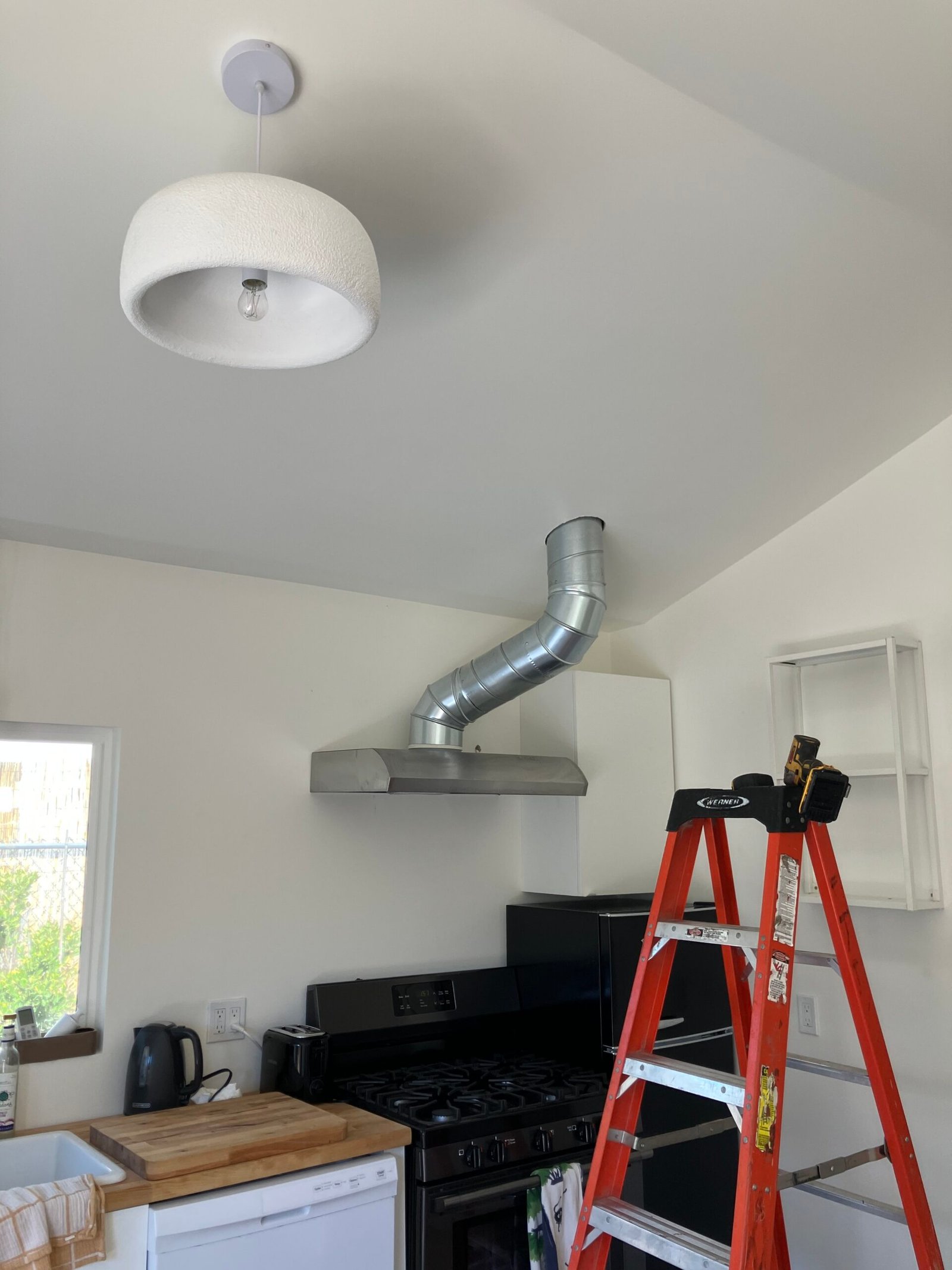 Experienced HVAC technician testing furnace controls and airflow with professional diagnostic tools
